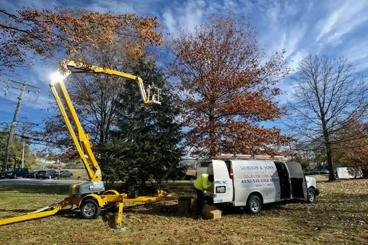 Public works electrical crew servicing streetlight infrastructure using a bucket truck in Baltimore, MD